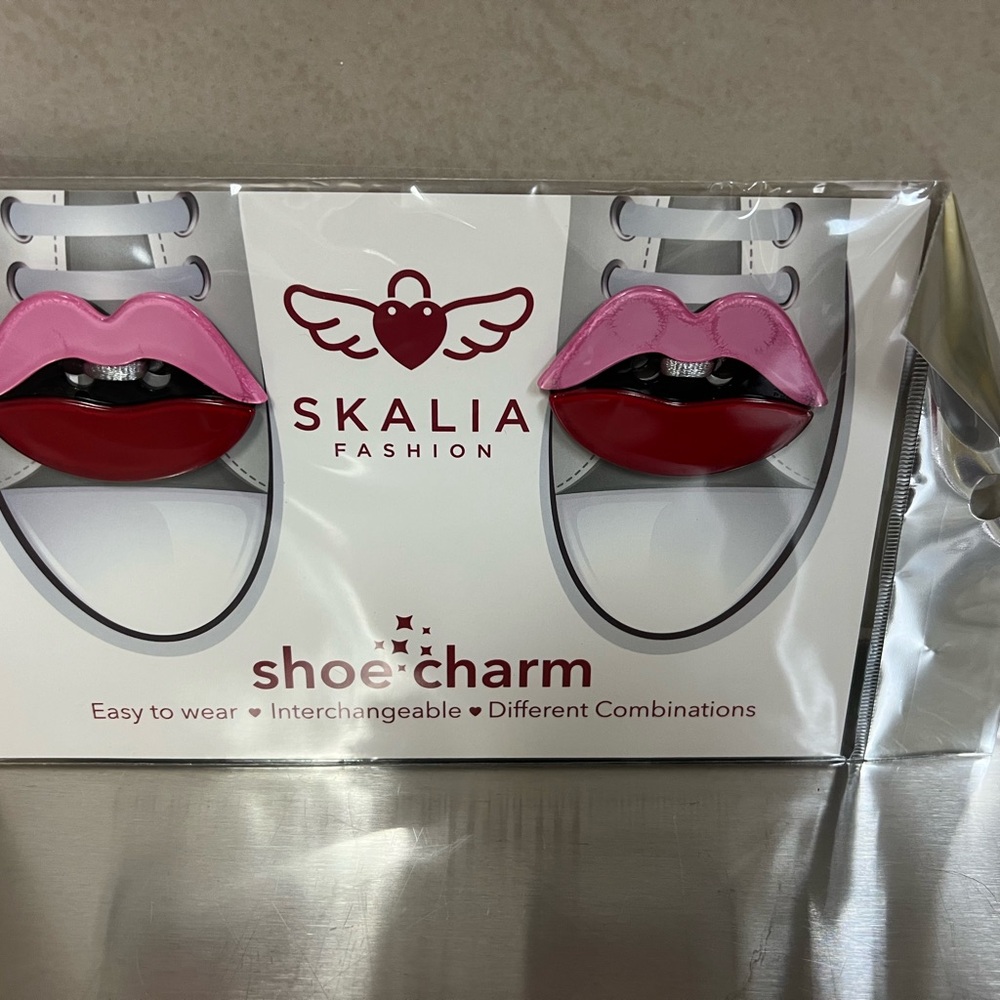 This item is Two pairs of  lip shoe charms from the brand Skalia Fashion.